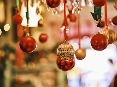 A collection of vibrant silicone ornaments hanging against a soft, neutral background.