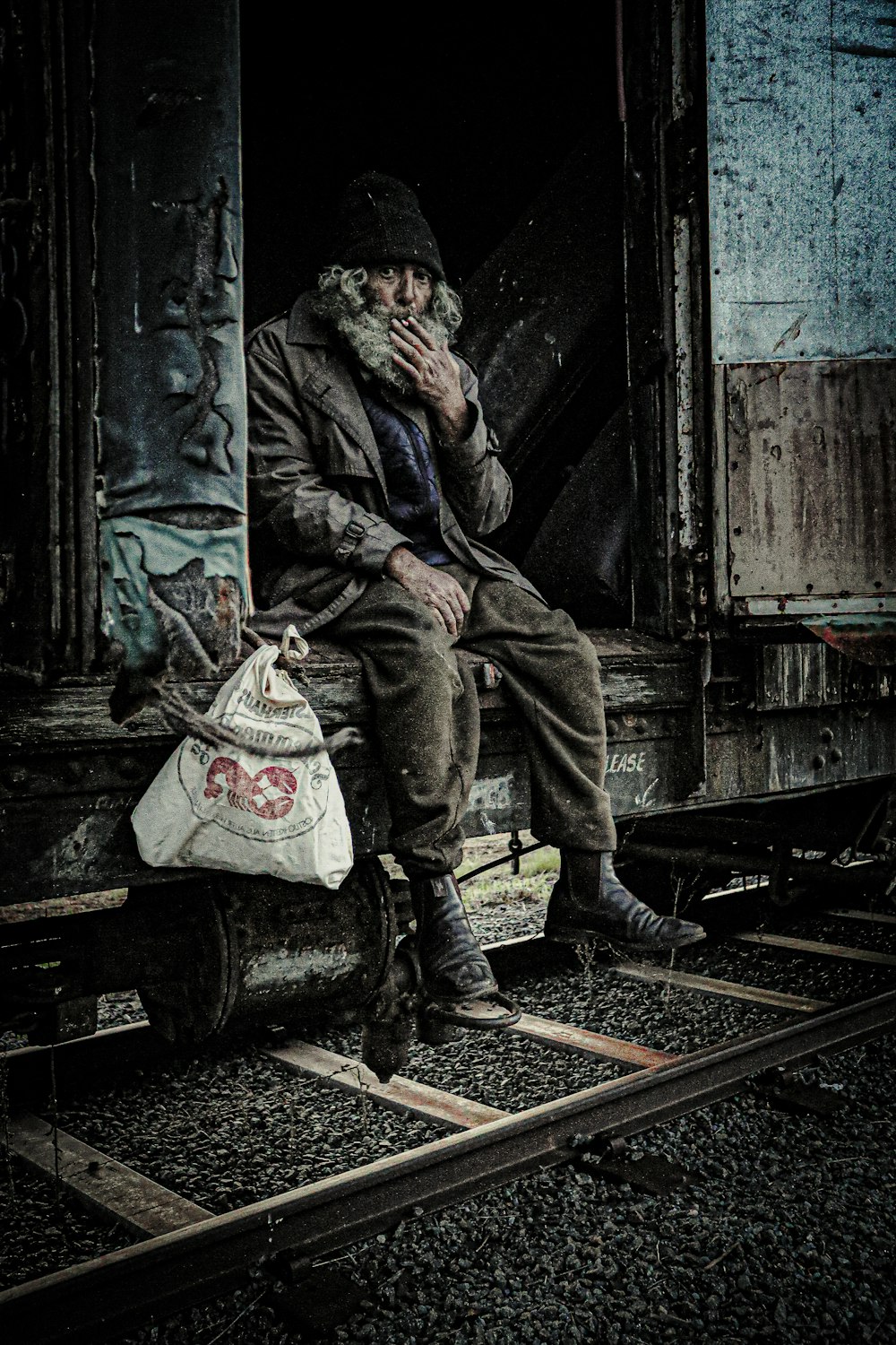 a man is sitting on a train car