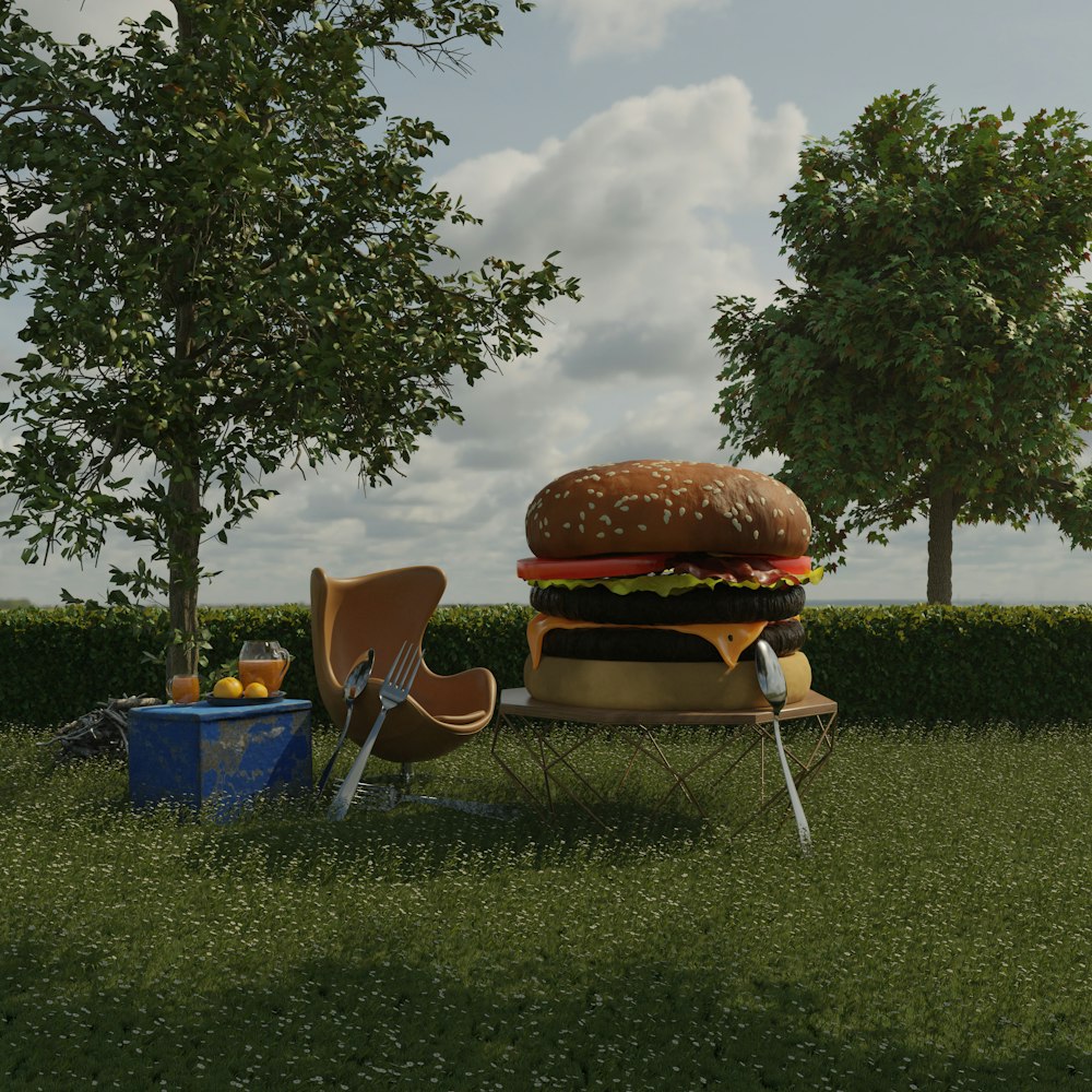 a large hamburger sitting on top of a lush green field