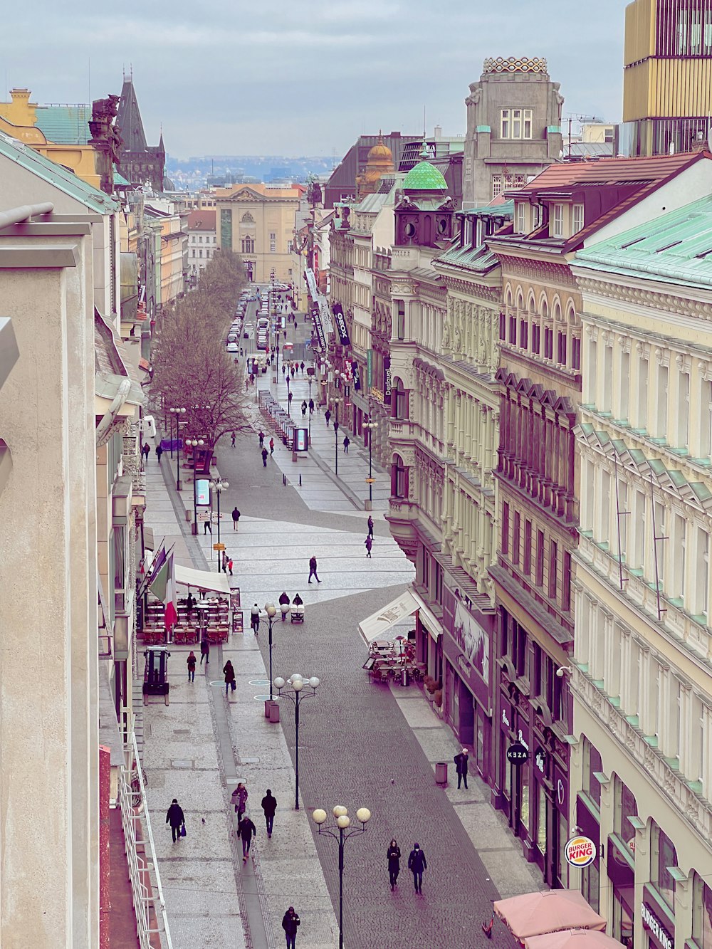 a city street filled with lots of tall buildings