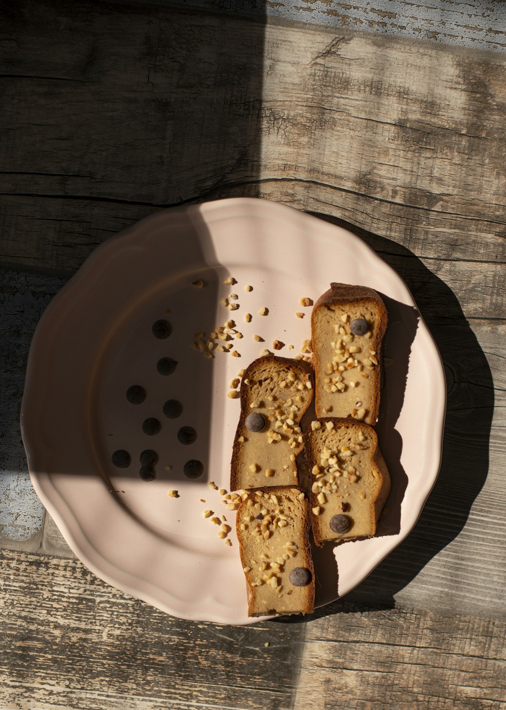 a white plate topped with slices of cake