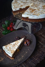 Healthy chocolate cheesecake with a smooth texture, garnished with cacao nibs and banana slices.