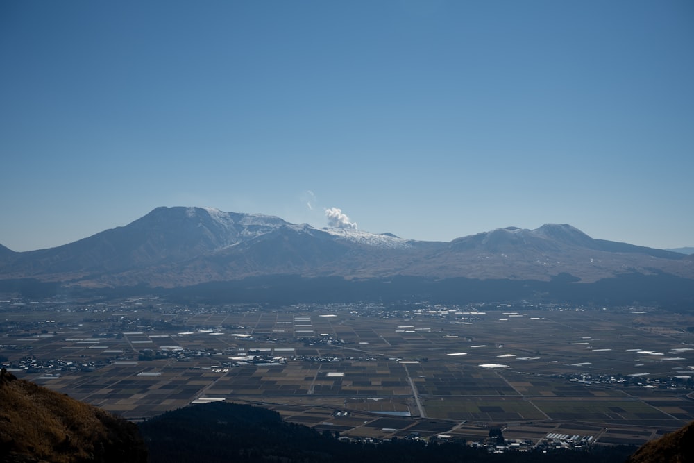 a view of a mountain range with a city below