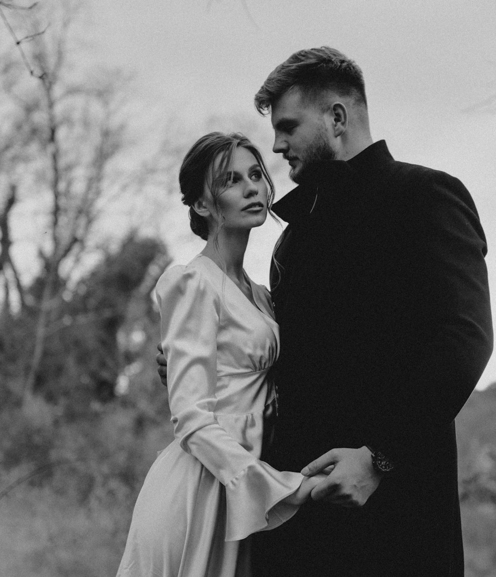 a man and a woman standing next to each other