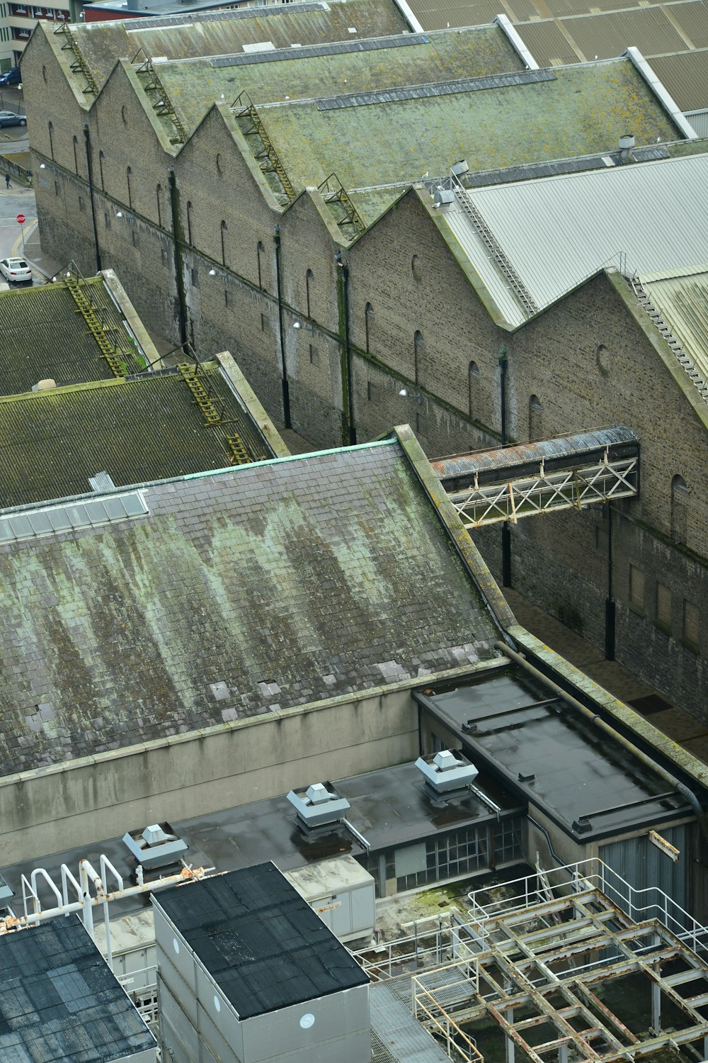 an aerial view of rooftops and buildings in a city