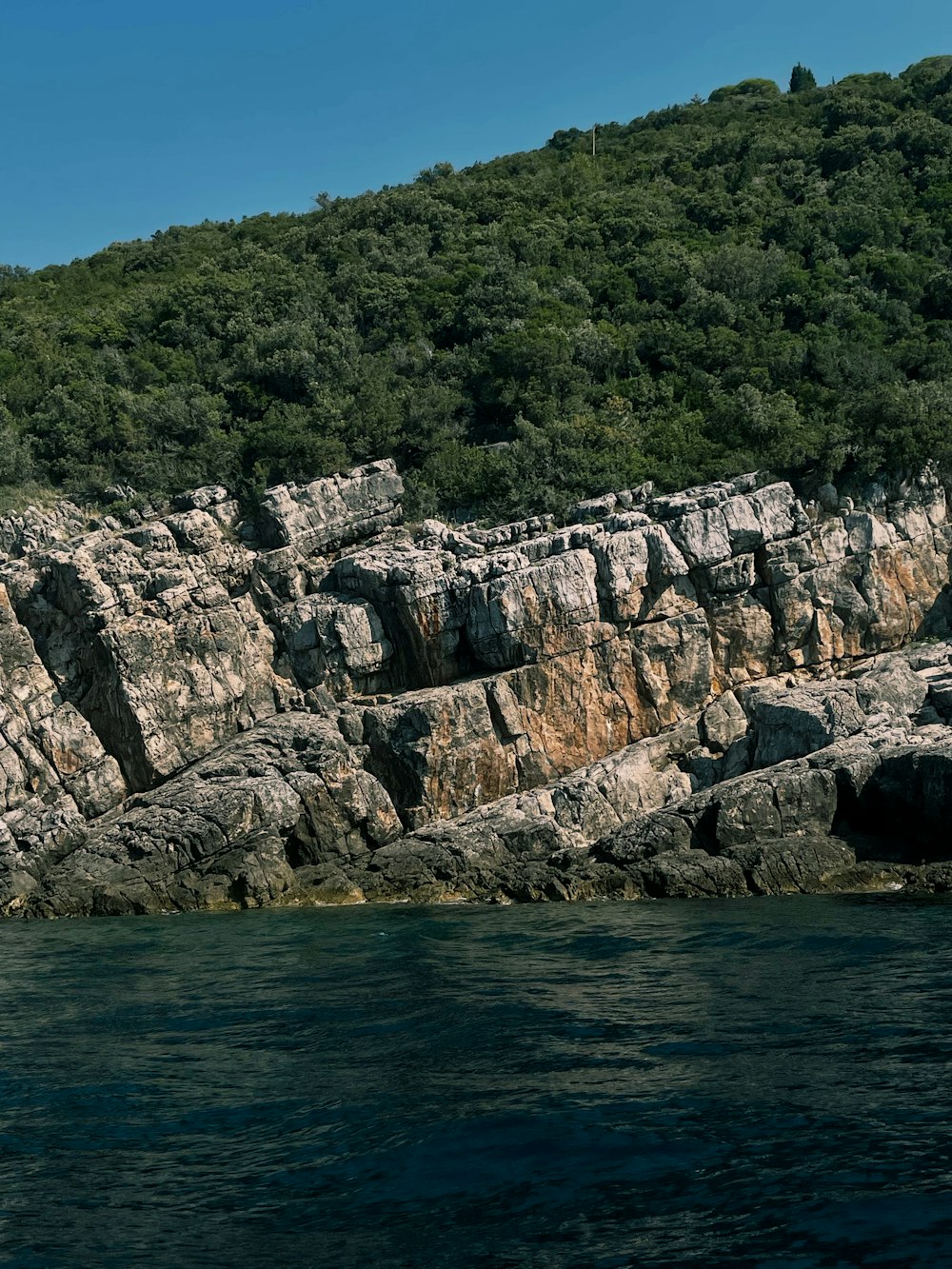 a large rock formation on the side of a mountain