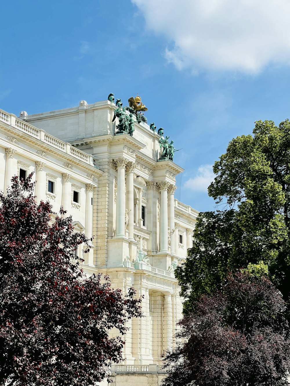 a large white building with a statue on top of it