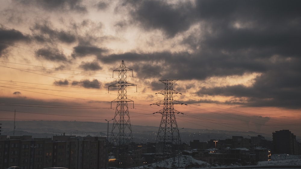 a couple of power lines sitting above a city