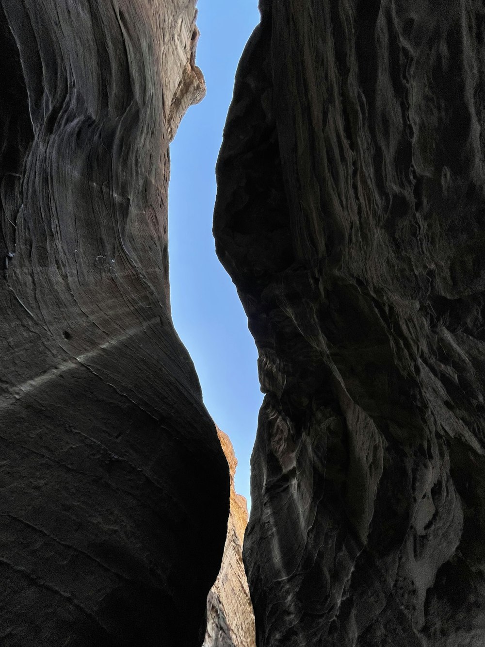 a narrow slot in the side of a mountain