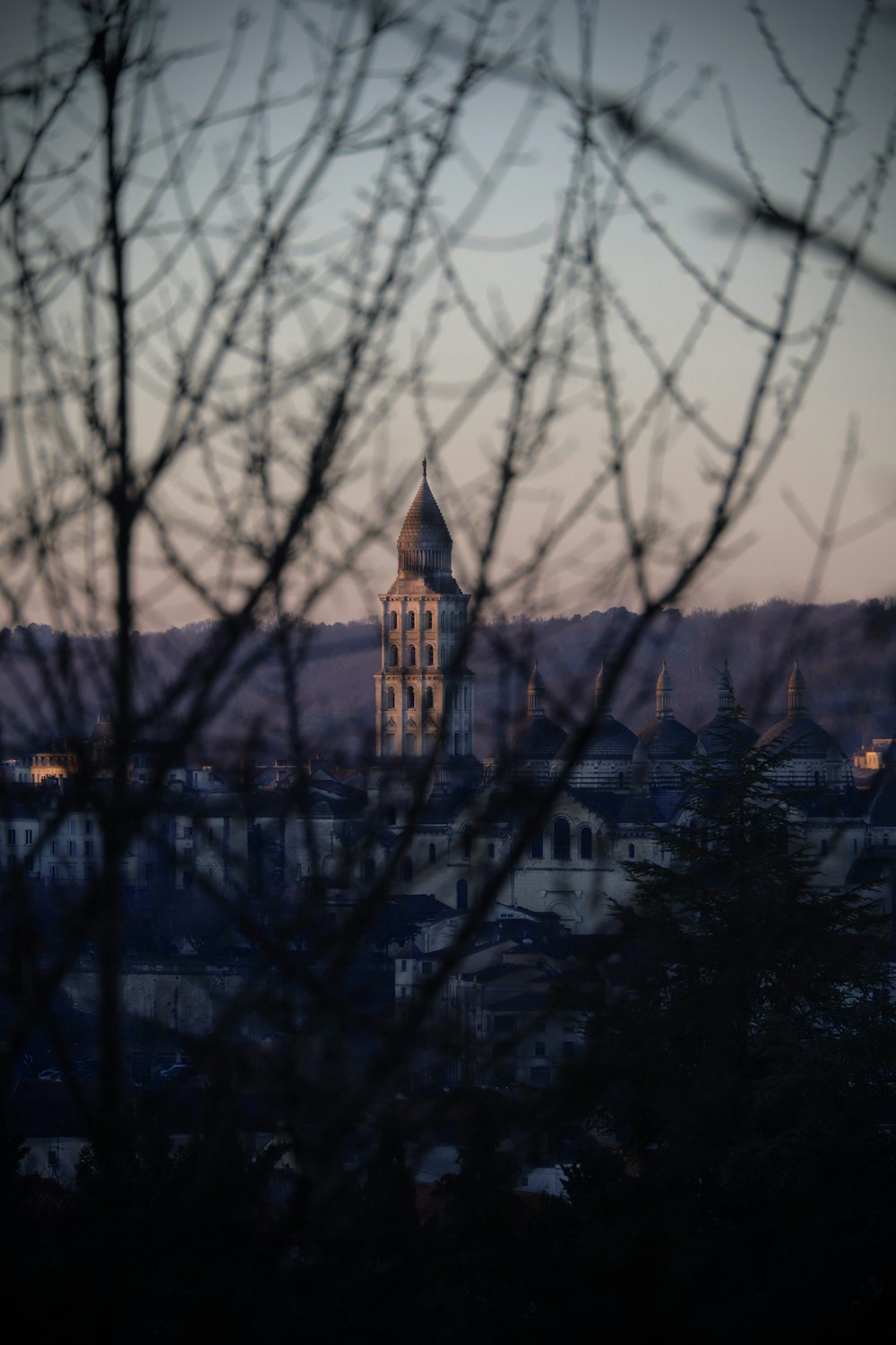 a view of a city with a clock tower in the distance