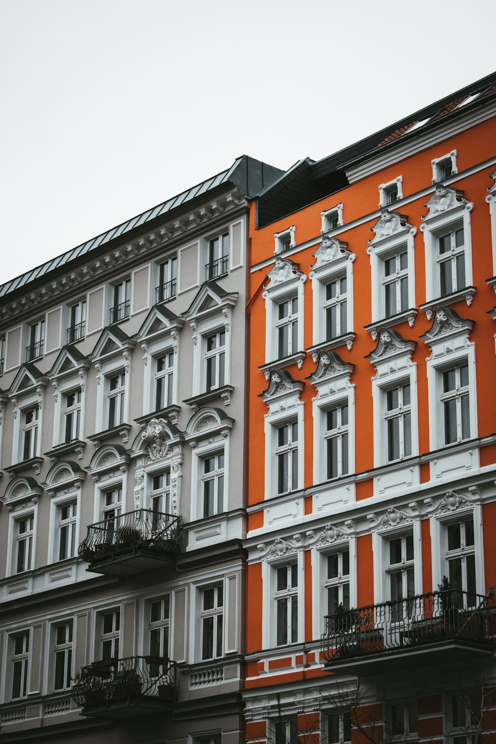 an orange and white building with balconies and balconies