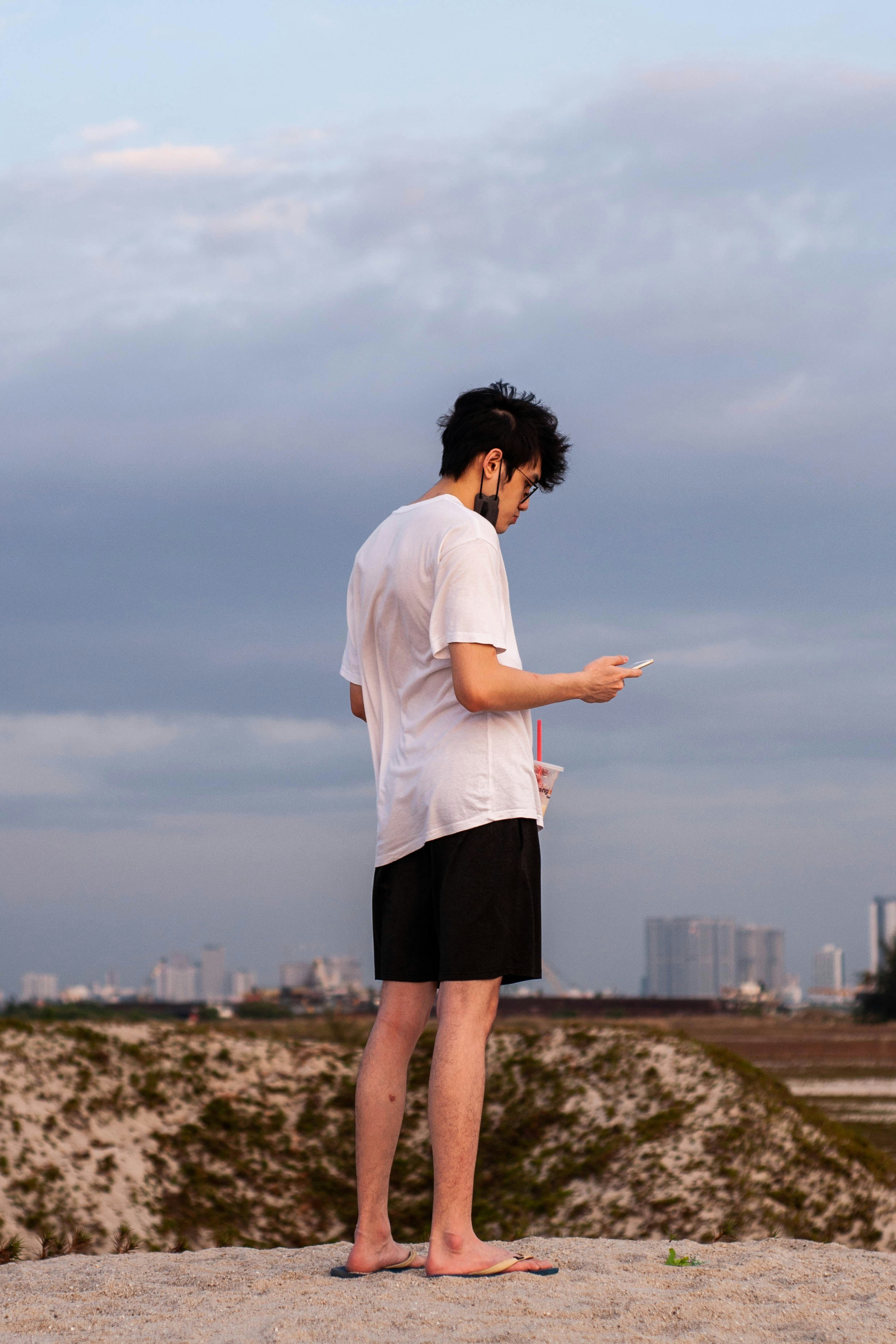 a man standing on top of a sandy beach