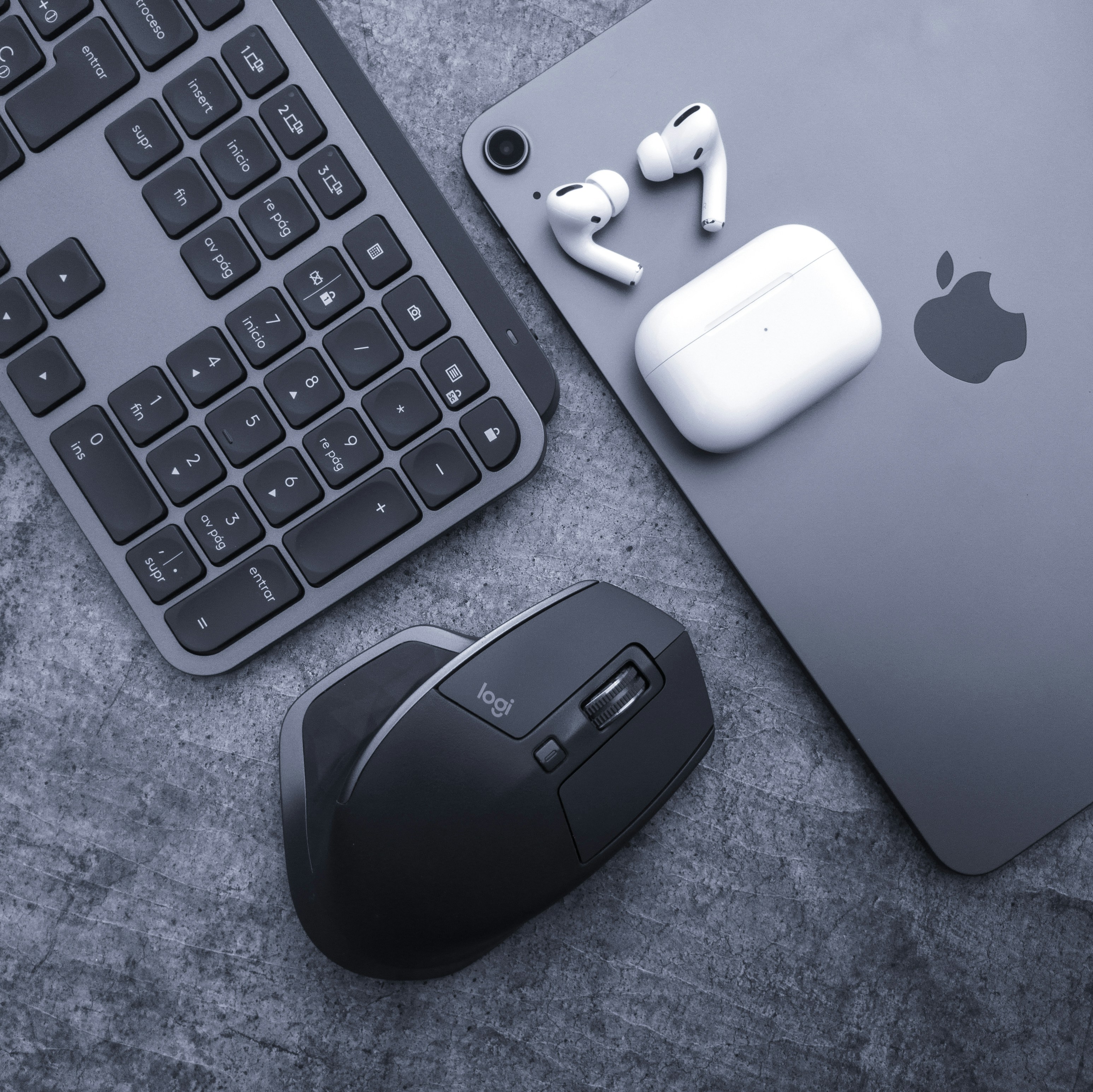 An apple keyboard, mouse, and headphones on a table photo – Free ...