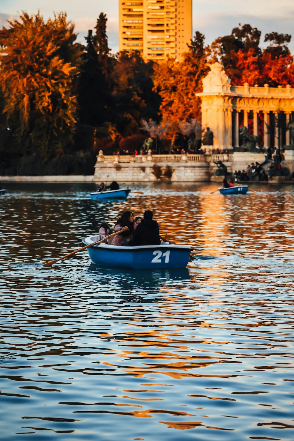 a couple of people in a small boat on a lake