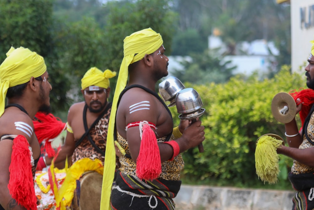 a group of men dressed in colorful costumes