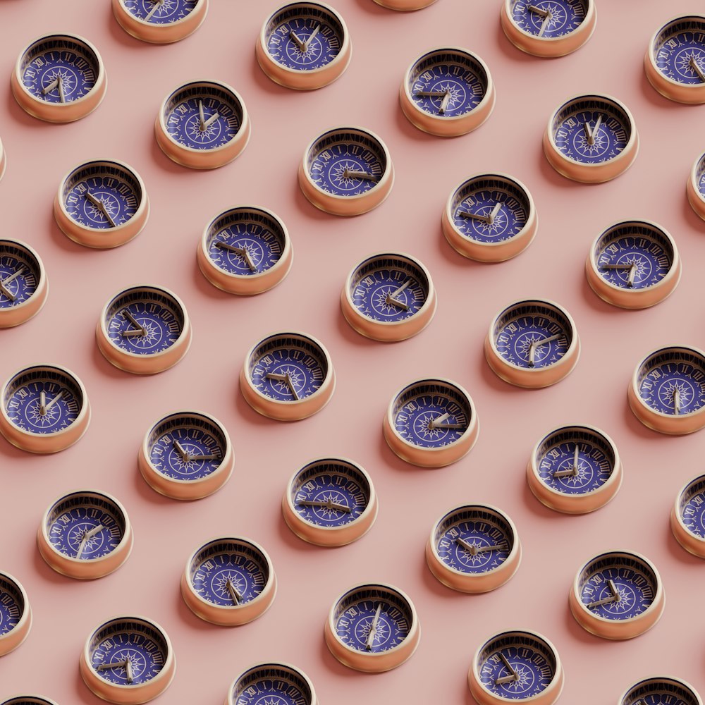 a group of clocks sitting on top of each other