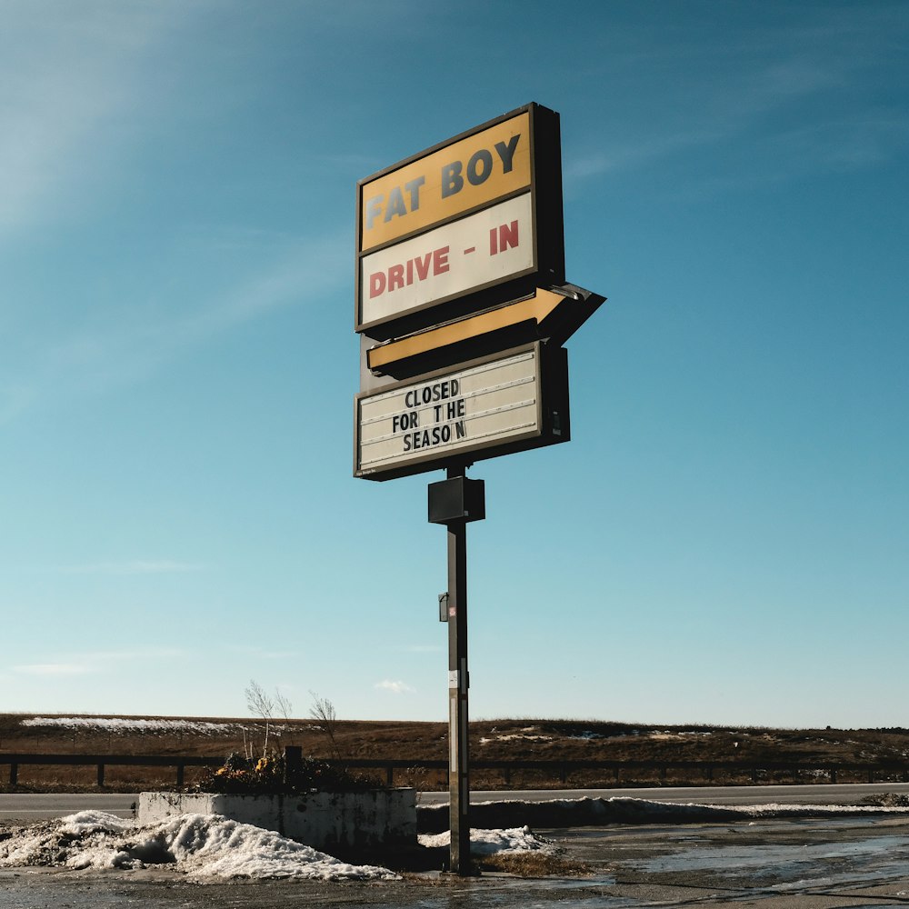 a sign for a drive - in in a parking lot