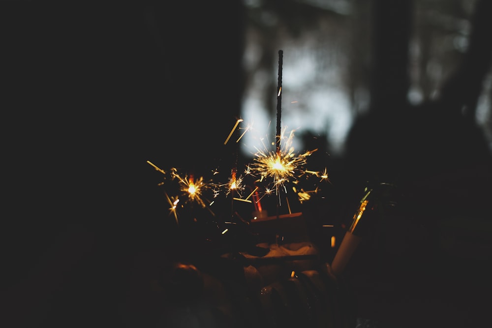 a person holding a sparkler in their hand