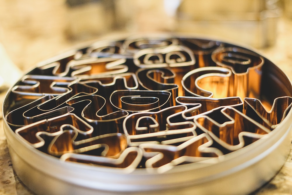 a round metal container with letters and numbers on it