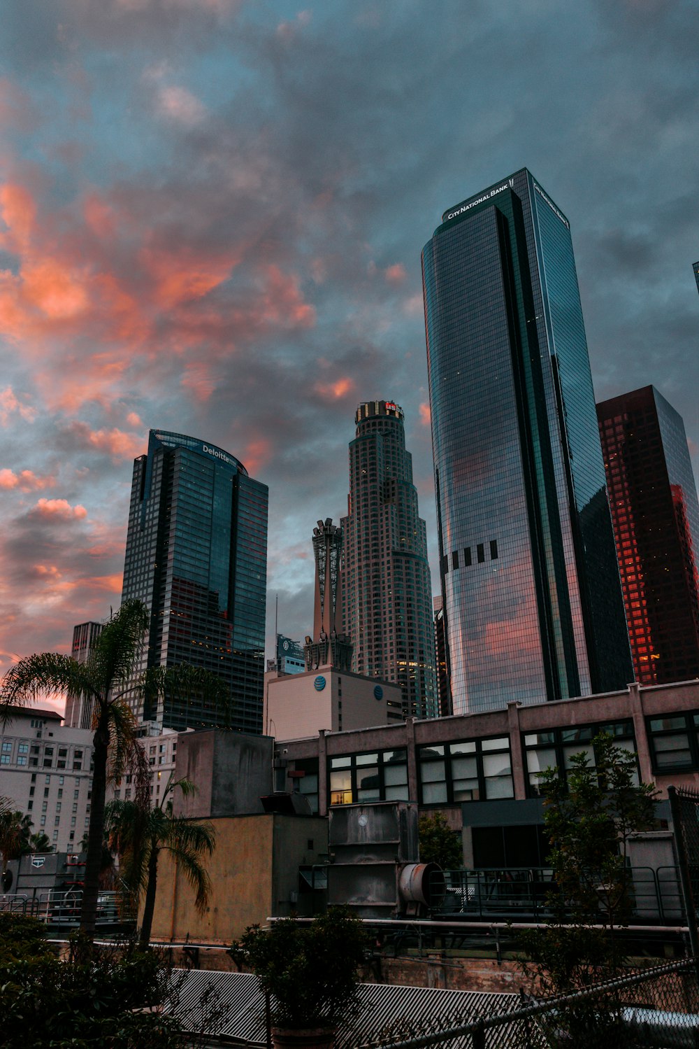 a view of a city skyline at sunset