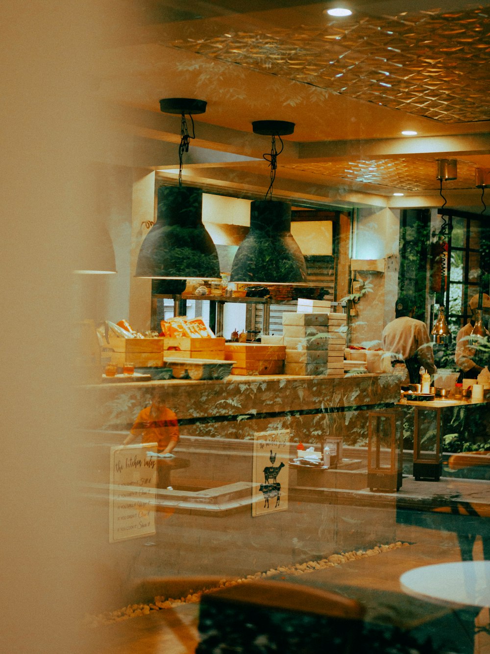 a view of a restaurant through a glass window