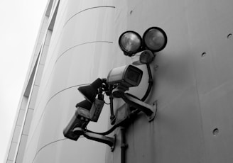 a security camera attached to the side of a building