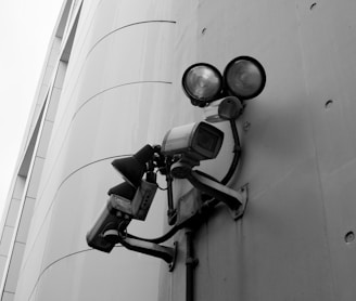 a security camera attached to the side of a building