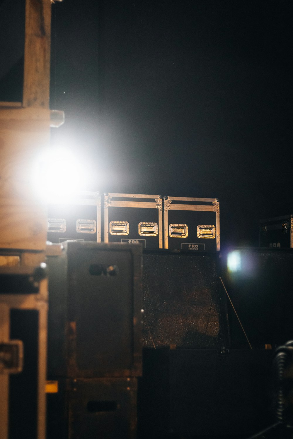 a light shines brightly on a stack of crates