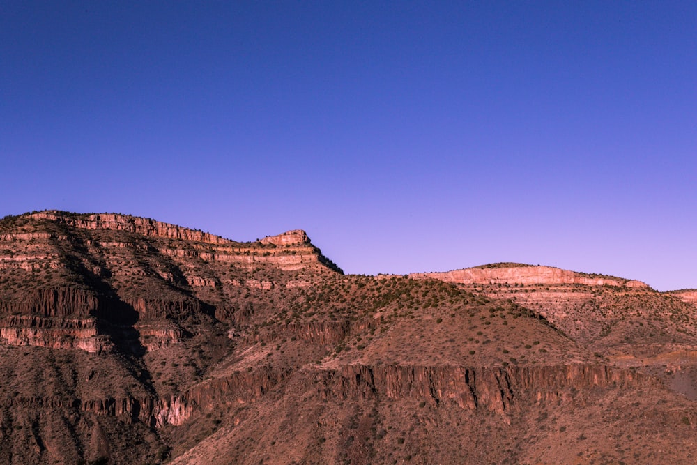 a view of a mountain range with a clear blue sky