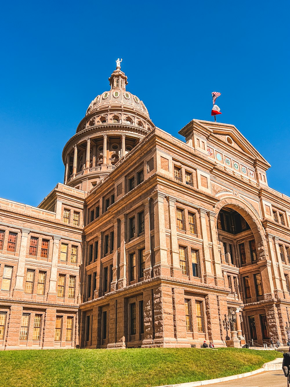 a large building with a flag on top of it