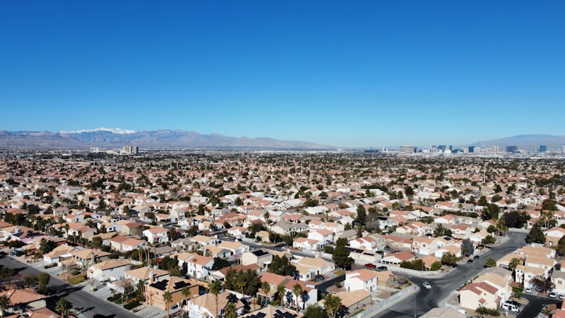 Aerial view of Las Vegas homes with mountains behind, showing a stable Clark County housing market in 2026