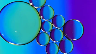 Vibrant animated bubbles floating over a sleek manufacturing line.