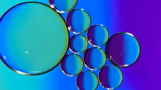 Vibrant animated bubbles floating over a sleek manufacturing line.