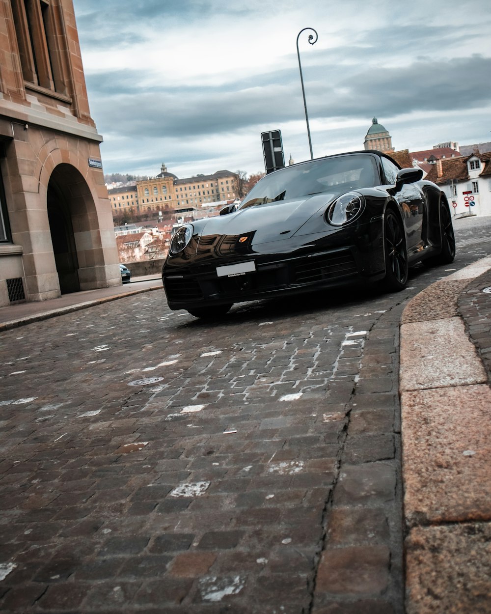 a black sports car parked on the side of the road