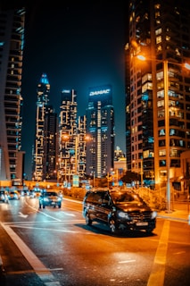 a busy city street at night with a lot of traffic
