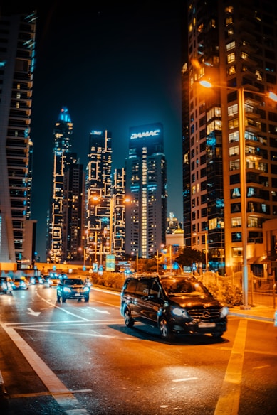 a busy city street at night with a lot of traffic