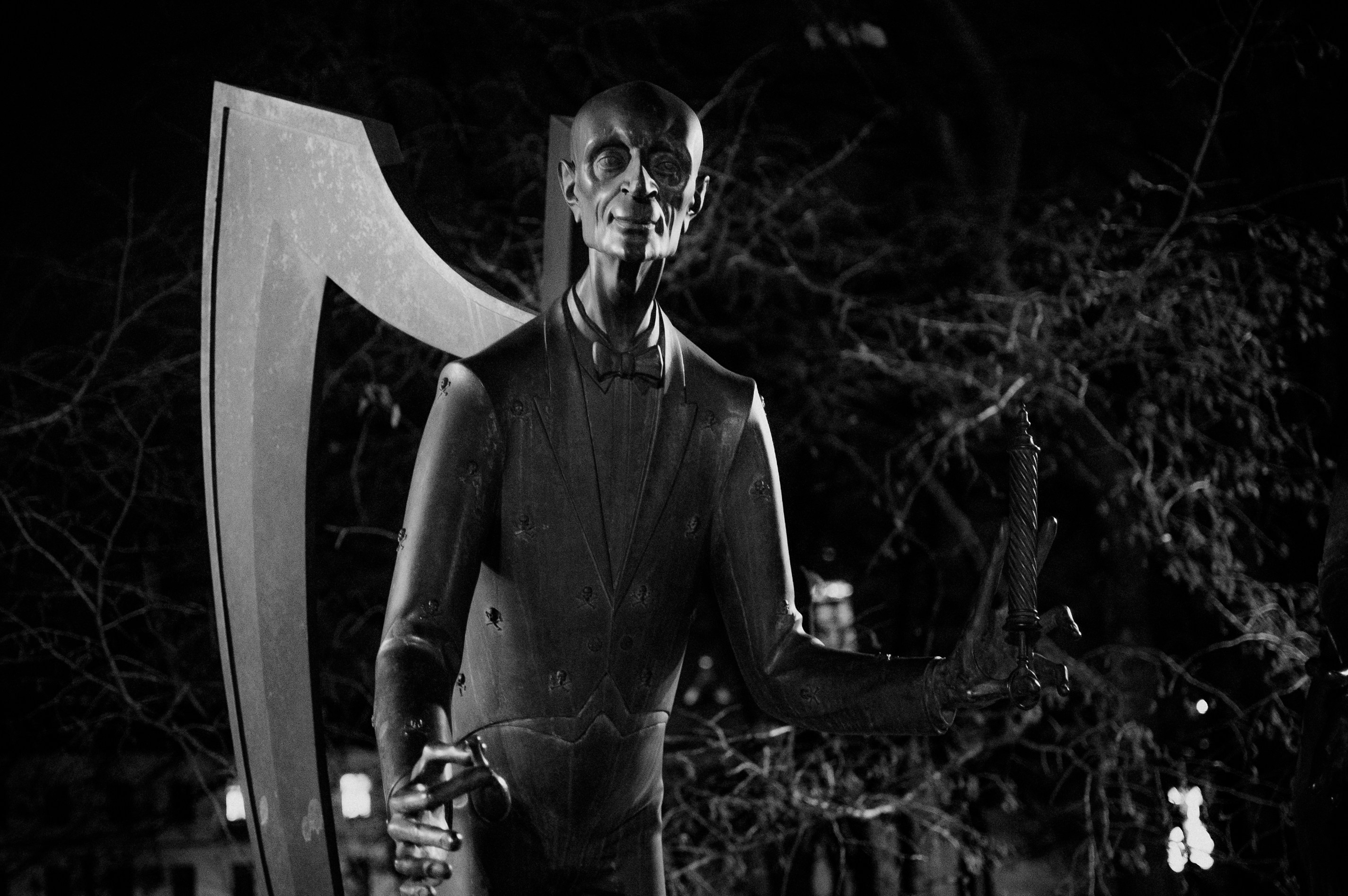a statue of a man holding a giant axe
