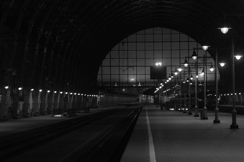 a black and white photo of a train station