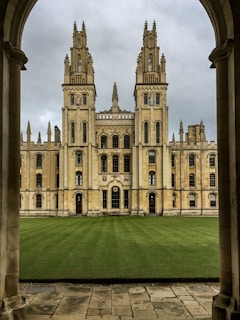 a large building with a large lawn in front of it
