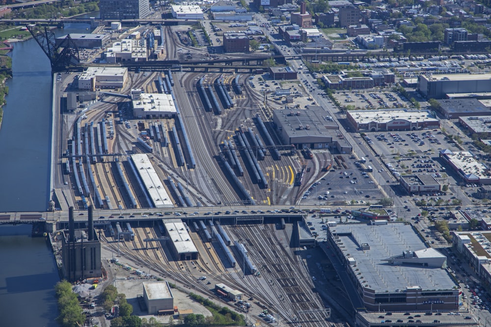 an aerial view of a train yard in a city