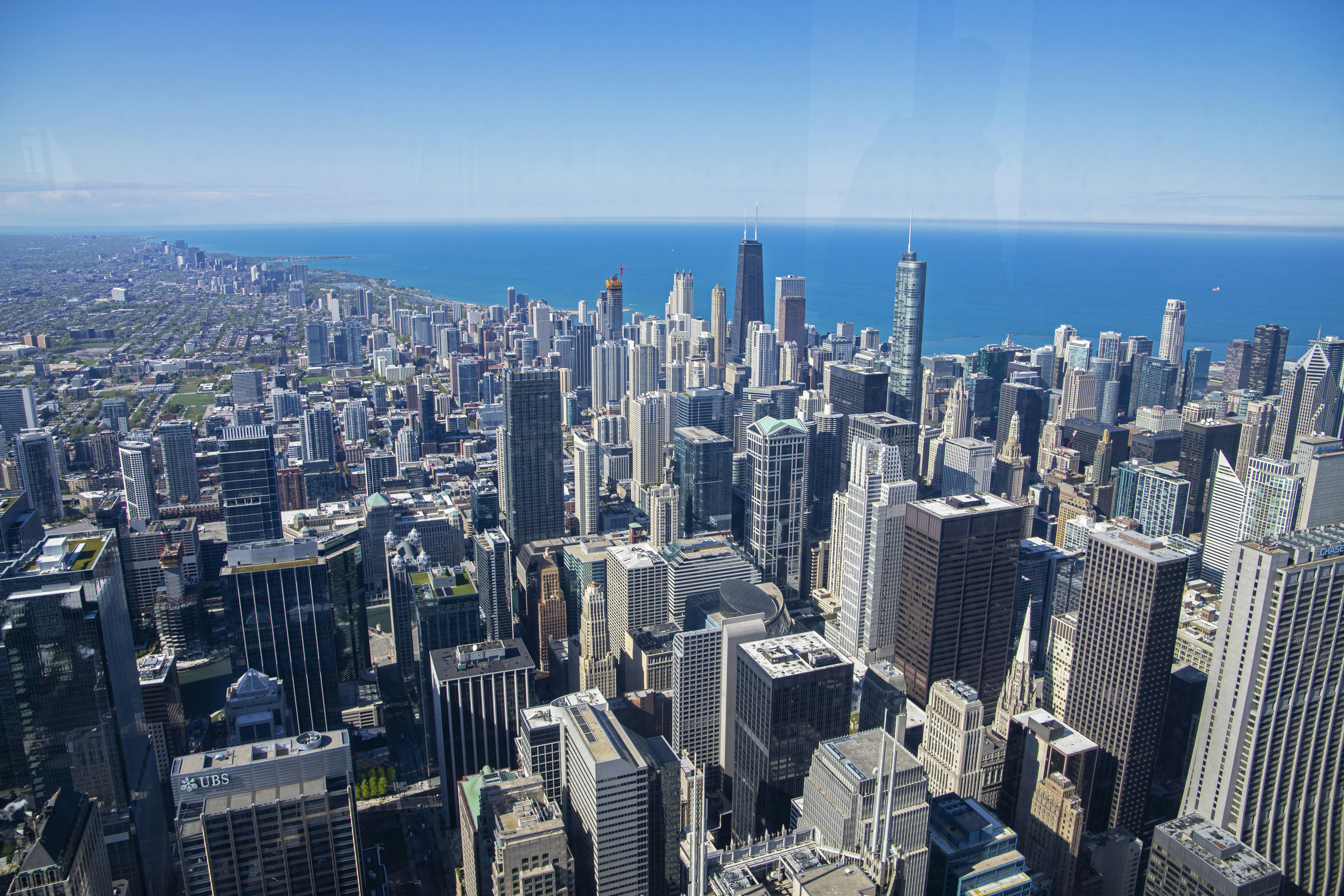 a view of a city from the top of a skyscraper, 