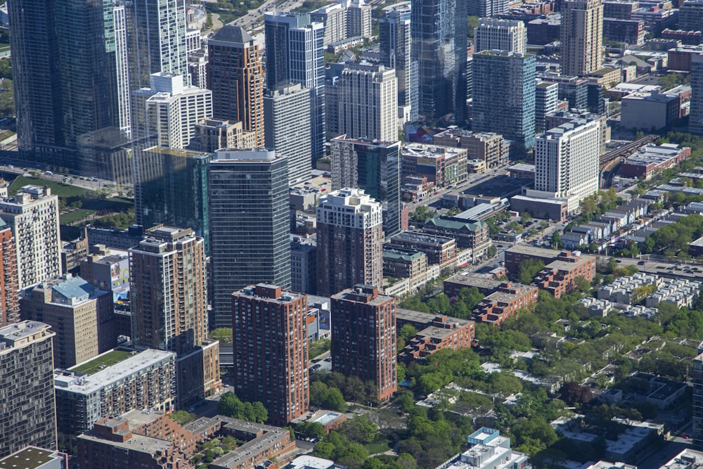 an aerial view of a city with tall buildings