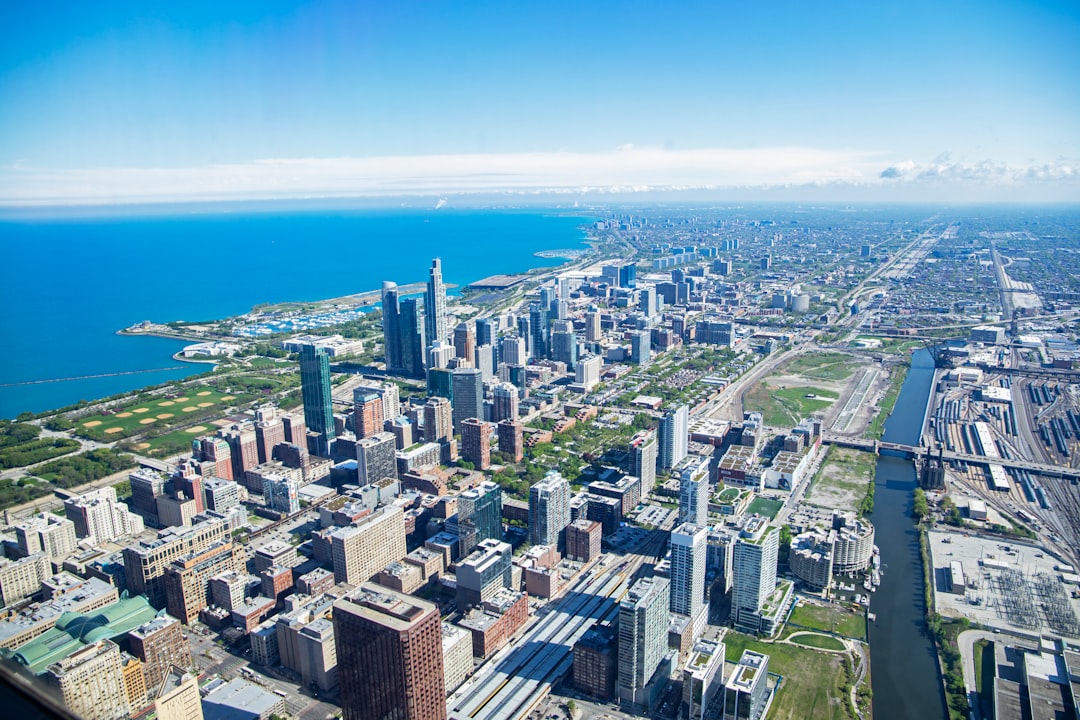 an aerial view of a city and the ocean,