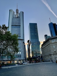 a couple of tall buildings sitting next to each other