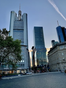 a couple of tall buildings sitting next to each other