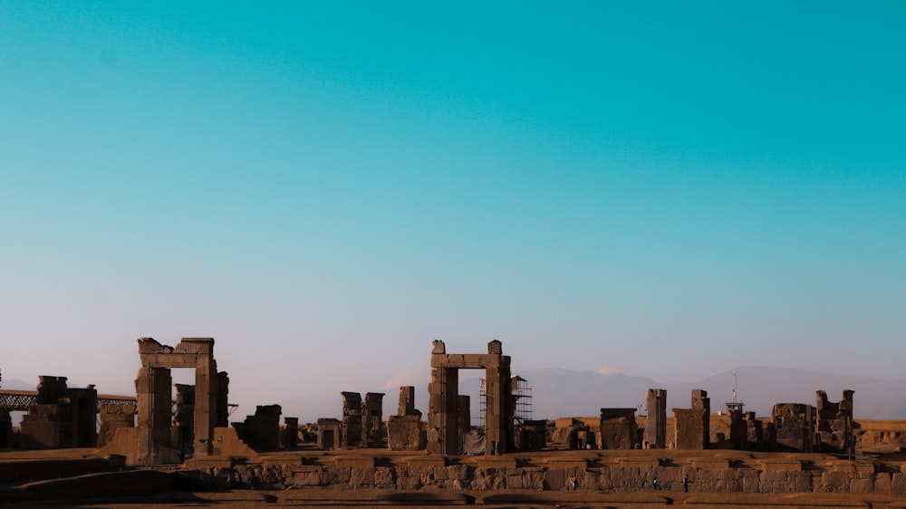 the ruins of the ancient city of palmyran are silhouetted against a blue