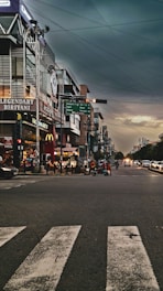 a city street with cars and people on it