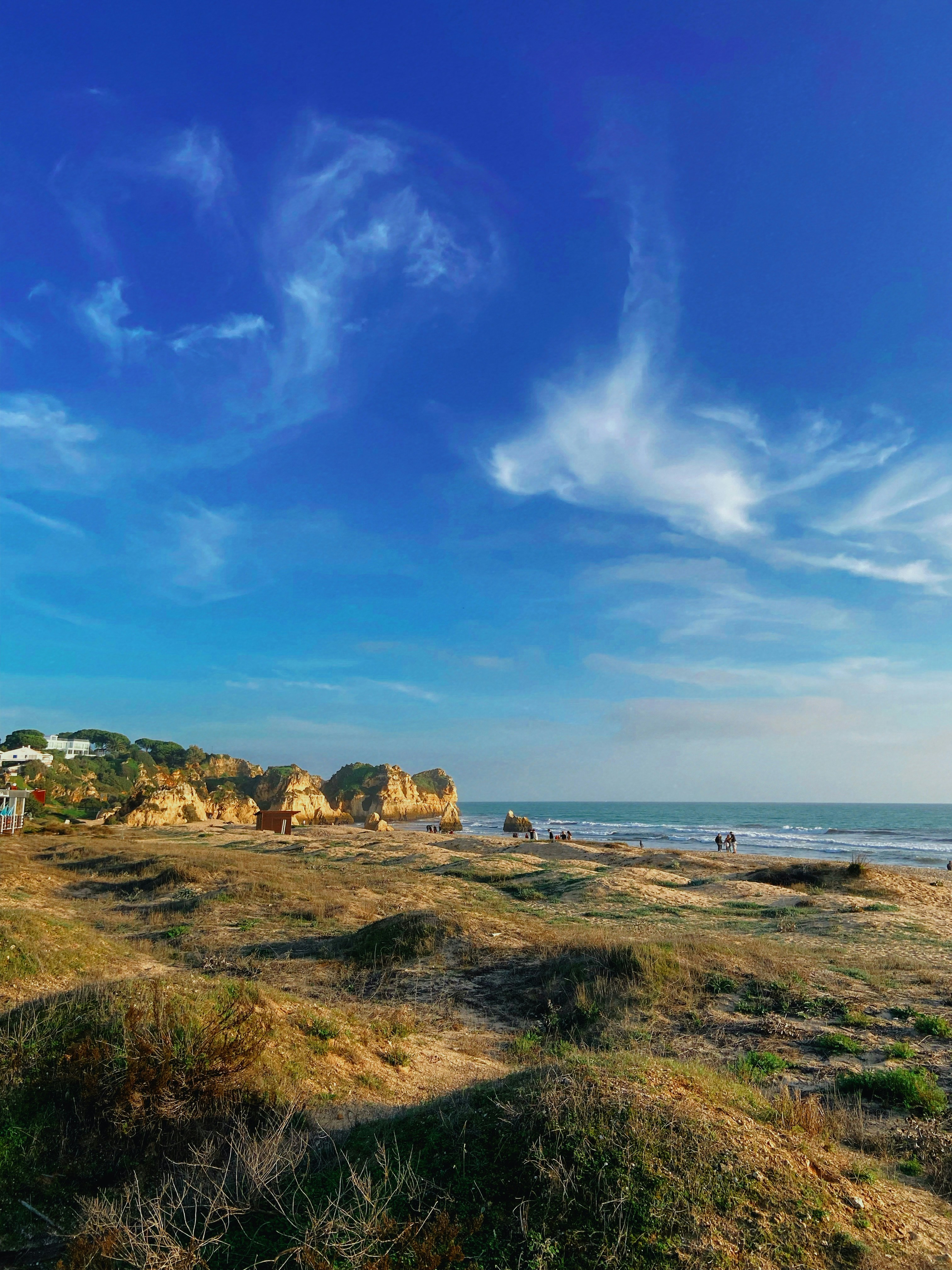 A sandy beach with a blue sky and some clouds photo – Free Alvor Image ...