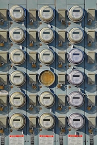 a bunch of buttons are attached to a wall