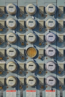 a bunch of buttons are attached to a wall
